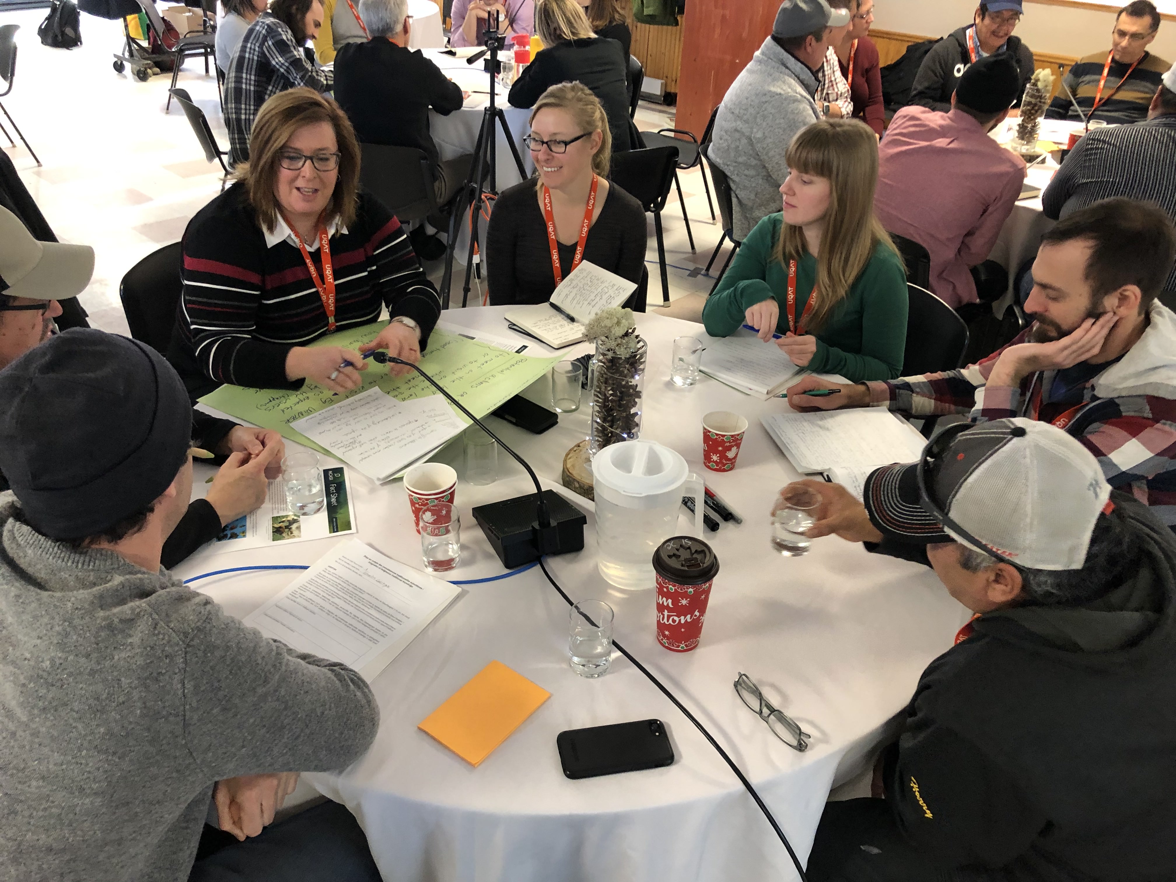 People sit around a table for discussion