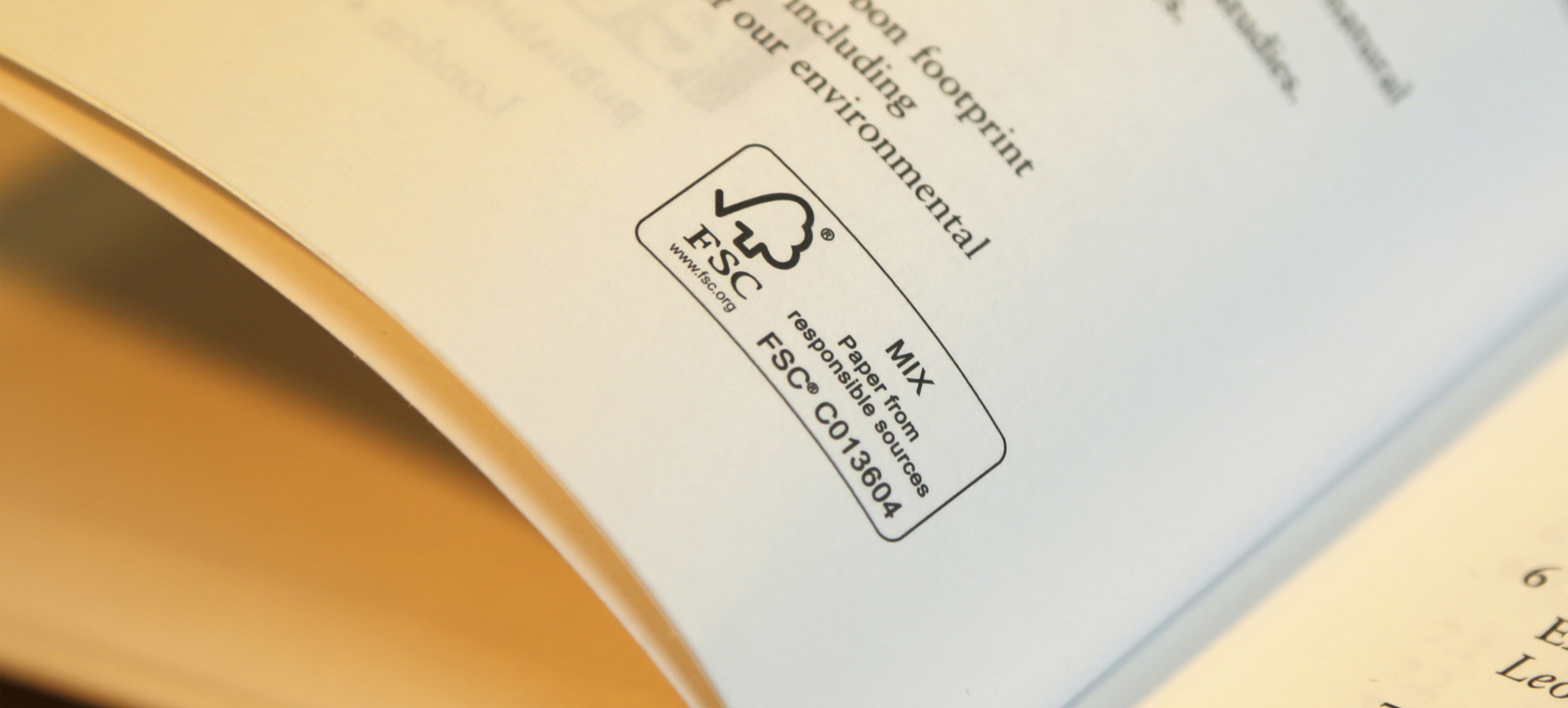 close up of open book pages with FSC label on it