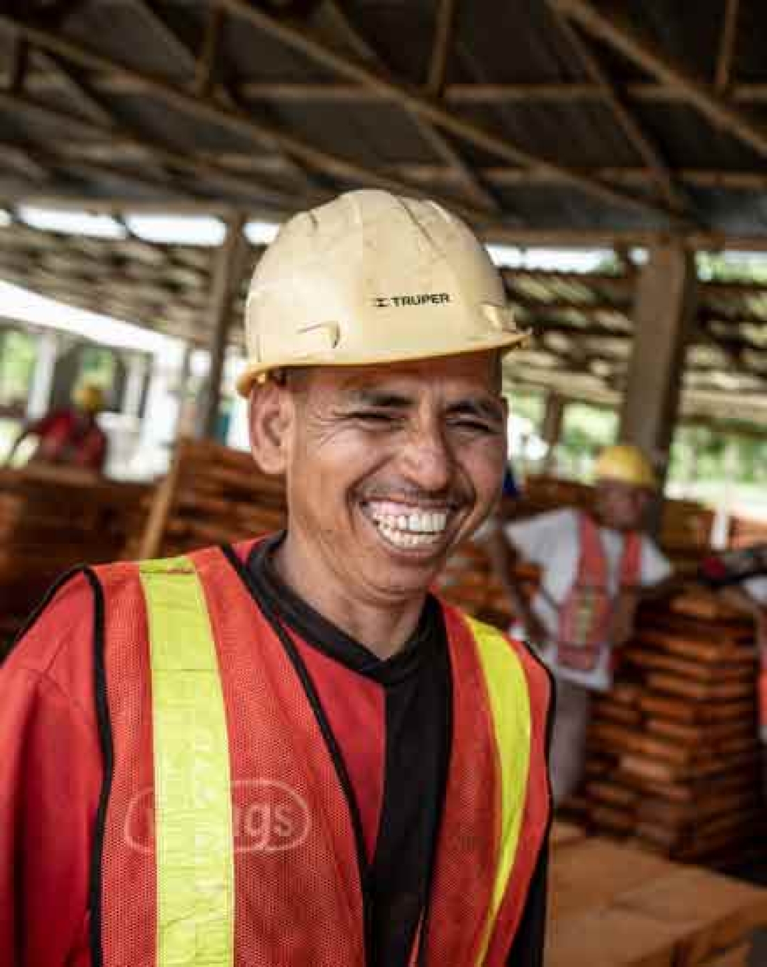 Worker smiling in a hard hat