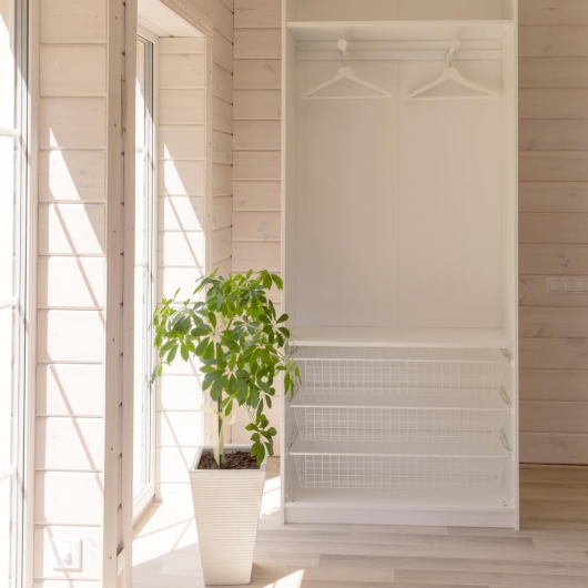 light wood interior with white wardrobe
