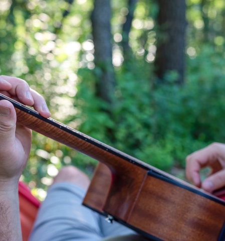 Playing guitar in the forests