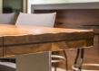 Wooden conference table with grey chairs