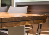 Wooden conference table with grey chairs